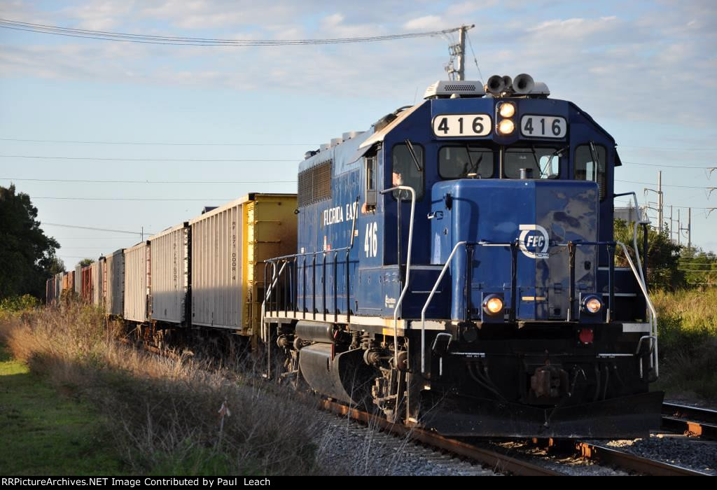 Southbound ballast train prepares to enter the yard